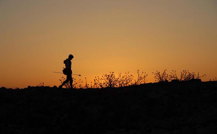 Silhouette of a surveyor at Dhiban, Jordan